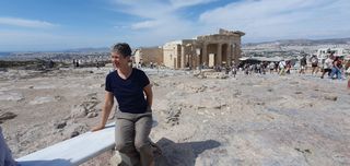 Taking some rest, the Temple of Athena in the background