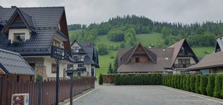 All houses have beautiful steep roofs in a typical mountain style